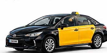 Black and yellow Toyota Corolla Barcelona taxi