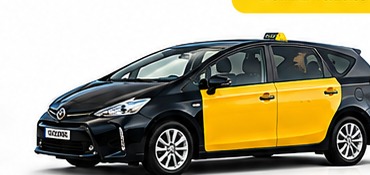 Black and yellow Toyota Prius Plus Barcelona taxi